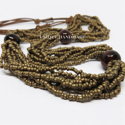 Collana in stile etnico realizzata a mano composta da 8 fili di perline color bronzo antico.